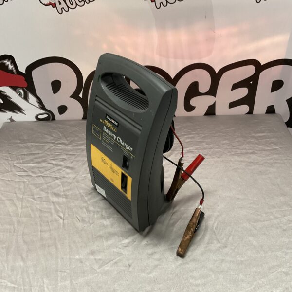 Halfords 12v car battery charger for vehicle maintenance.