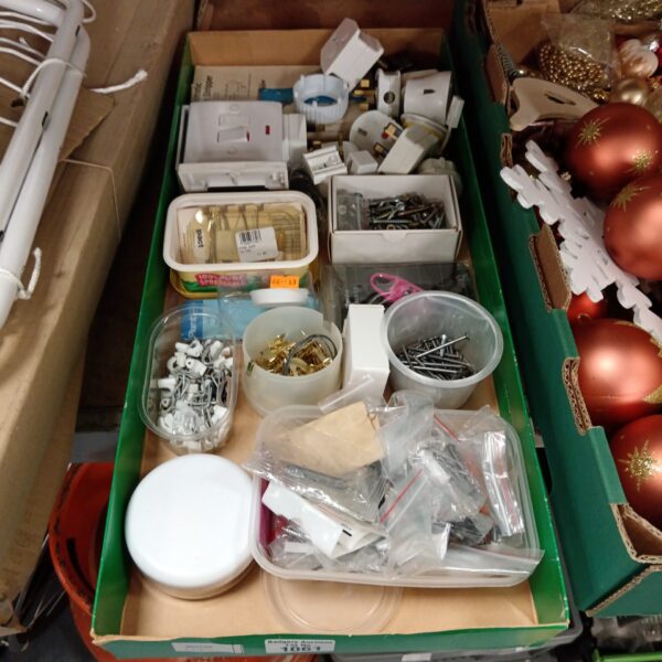 Tray of assorted hardware including screws and picture hooks.