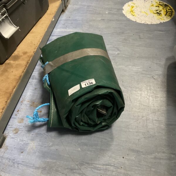 Rolled heavy duty tarpaulin for industrial or outdoor use.