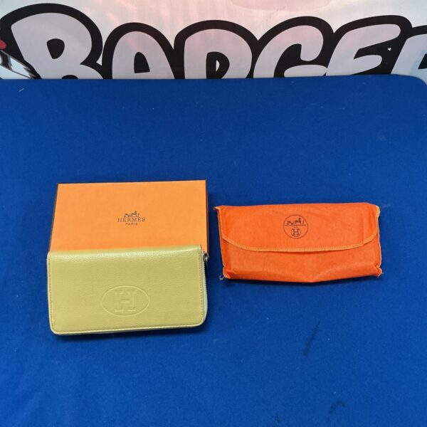 Hermes wallet, a classic leather bi-fold purse in good condition.