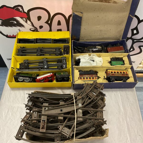 Vintage Hornby train set with track and railway accessories.