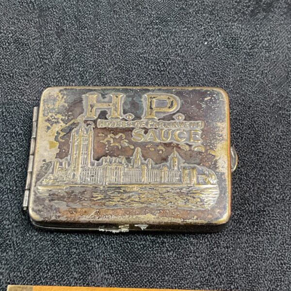 Vintage HP Sauce match holder with Houses of Parliament design.