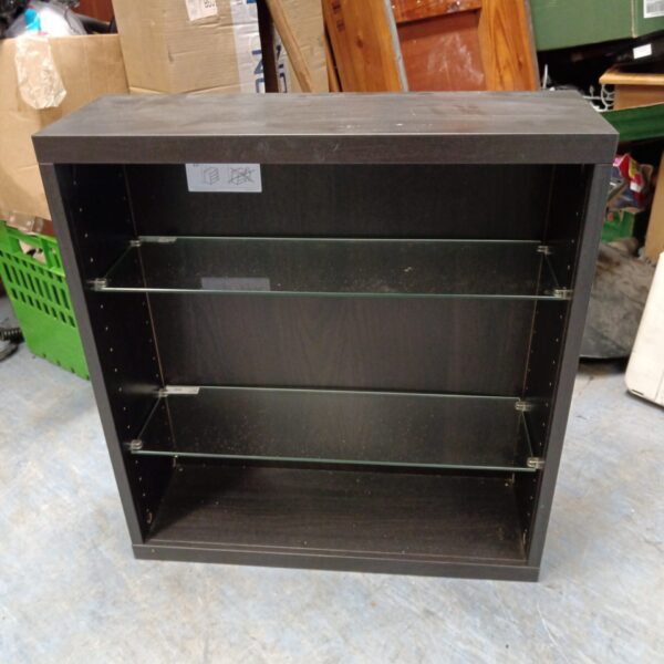 Black IKEA wall display cabinet with glass shelves.