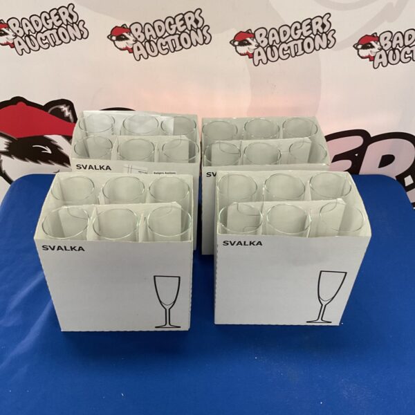 Four boxes of Ikea Svalka long stem wine glasses.