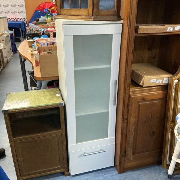 White Ikea glass fronted cabinet for display and storage.
