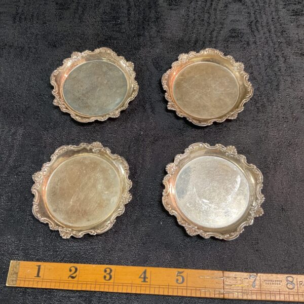 four 970 silver wine glass dishes 111.8 g and small silver photo frame