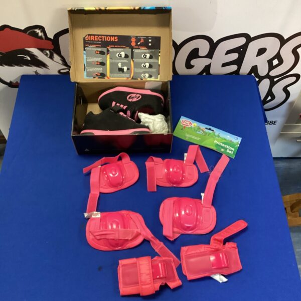 Pair of Black and pink Size 12 Children's Twin wheeled Heelys Skate Shoes With Set of Safety Pads