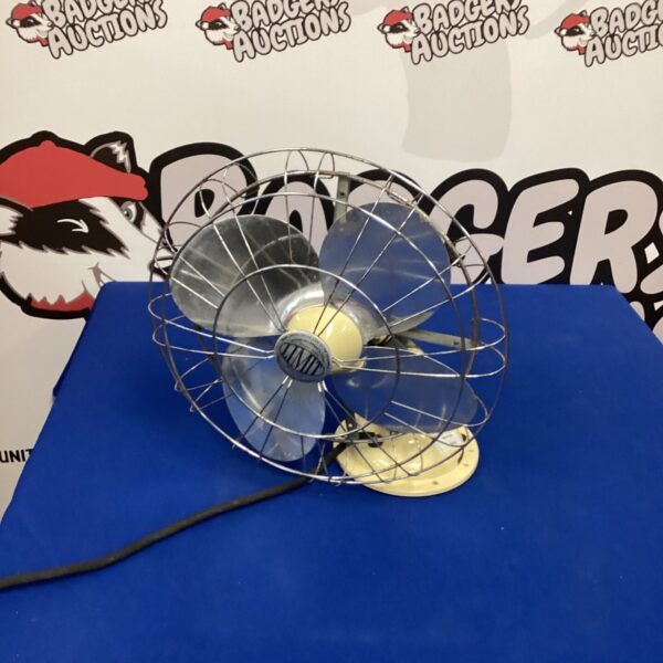 Vintage 1950s enamel limit desk fan. Works but blades catch wire guard
