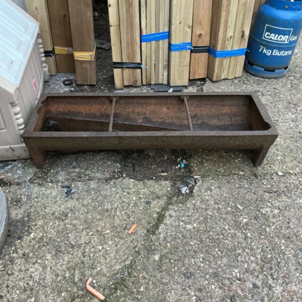 Vintage iron animal trough, ideal for farm or garden use.