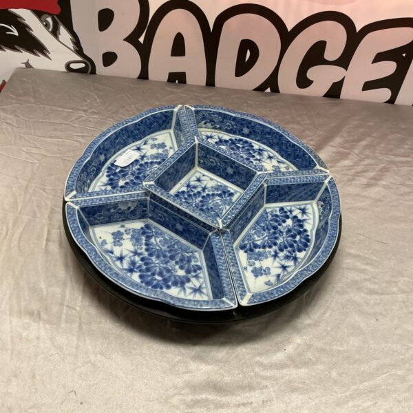 Antique Japanese lazy susan with blue and white porcelain design.