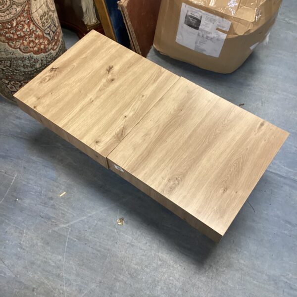 Two rustic Japanese style pine coffee tables on a floor.
