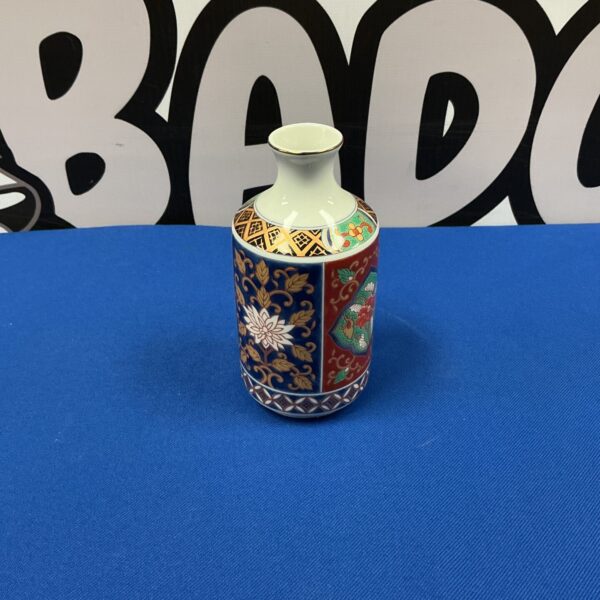 Vintage Japanese porcelain vase with a colourful floral pattern.
