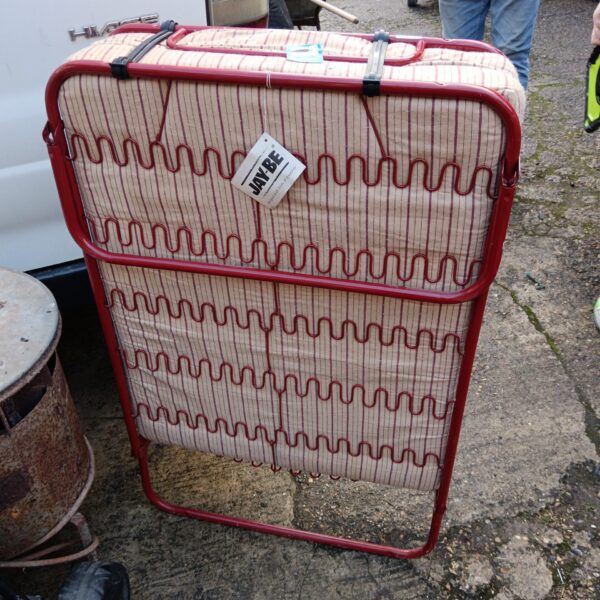 Vintage Jay Be folding bed in patterned fabric.