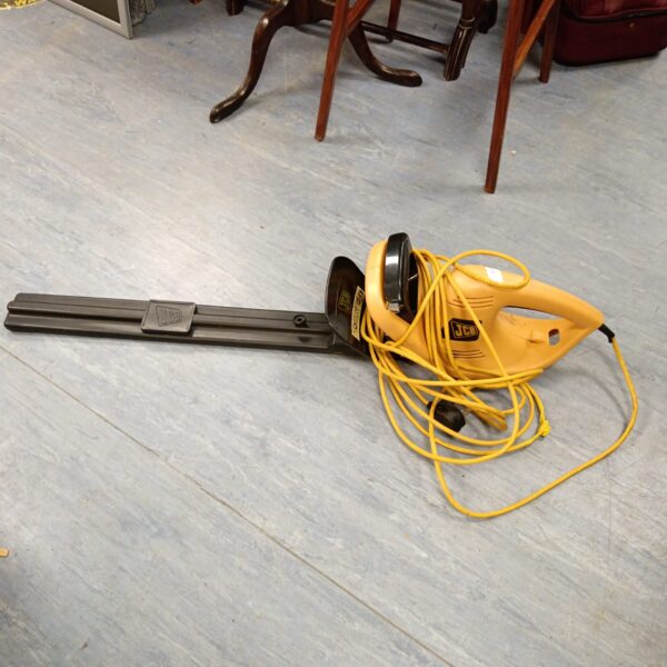 Vintage JCB electric hedge cutter for garden landscaping.