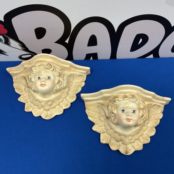 Vintage Jean Banks cherub wall shelf with delicate hand-painted details.