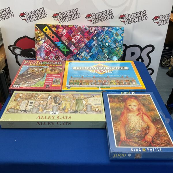 Sealed jigsaw puzzles and Dropmix music gaming system in box.