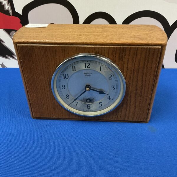 Front view of antique JW Benson mantle clock with wooden case.