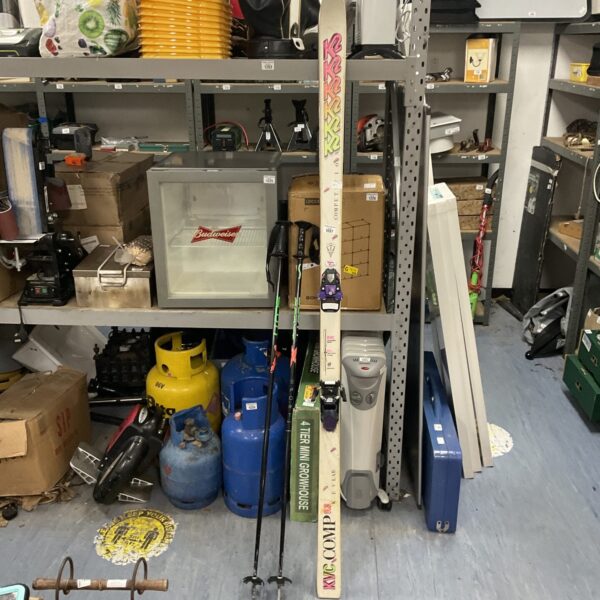 Vintage K2 competition skis with Scott poles for winter sports.