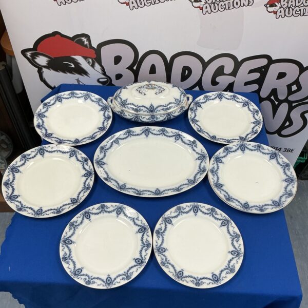 Vintage Keeling & Co china plates with floral pattern and gilded edges.