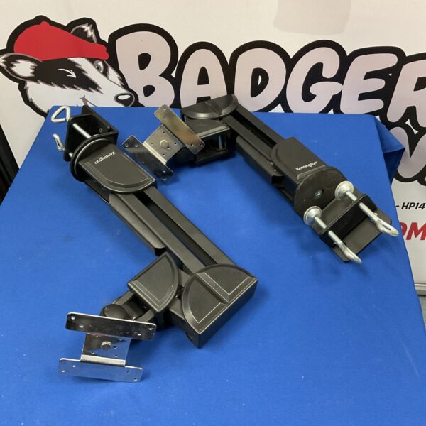 Dual Kensington monitor arms mounted on a desk.