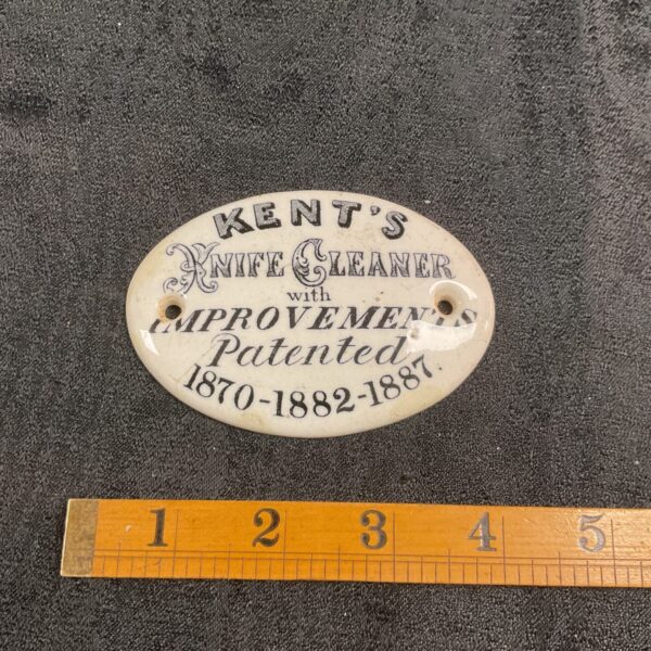 Vintage Kent's Knife Cleaner enamel advertising plaque for collectors.