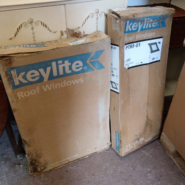 Two Keylite RF-01 roof windows in original packaging.