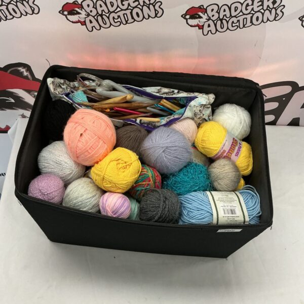 Colourful assortment of knitting wool in a box.