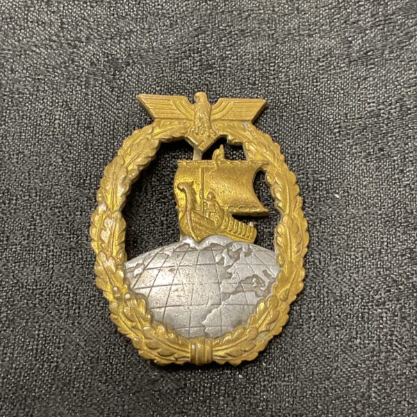 Front view of a WWII German Kriegsmarine Auxiliary Cruiser Badge.