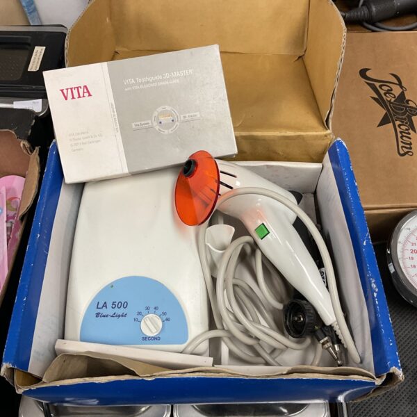 Vintage La 500 teeth whitening kit with blue light device.