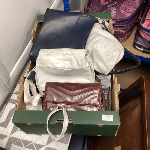 Tray of assorted ladies handbags and purses.