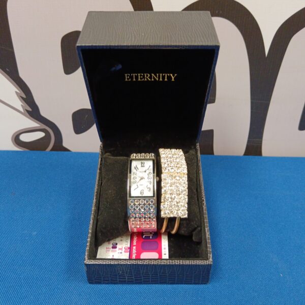 Ladies’ silver-tone quartz watch and bracelet set on display.