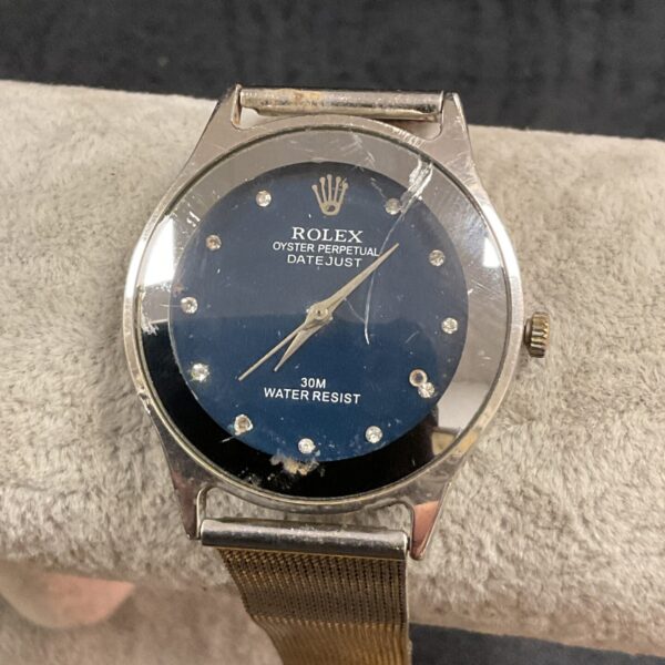 Ladies quartz wristwatch in the style of Rolex, front view.