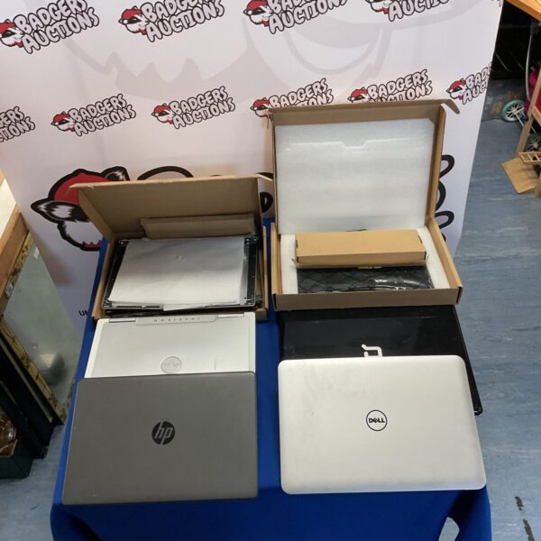 Lot of four laptops and spares for repair or parts.