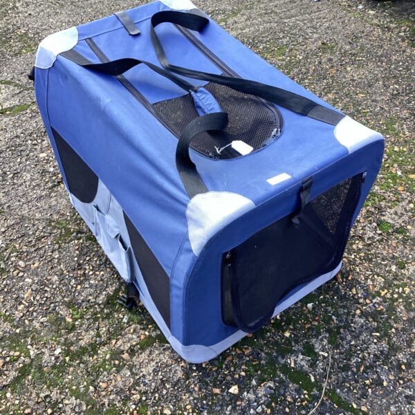 Large blue folding pet carrier for dogs and cats.
