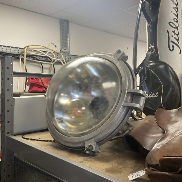Vintage industrial lamp with enamel shade, ideal for workshop lighting.