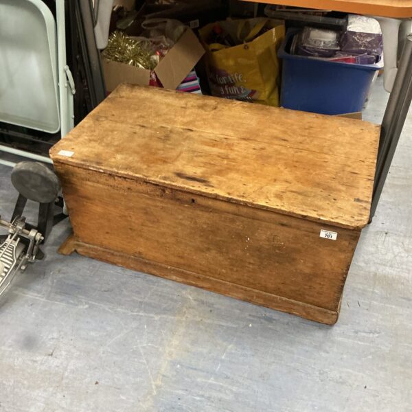Front view of a large, rustic wooden storage box.