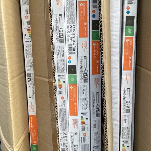 Stack of sealed LED lighting strip boxes, G13 model.