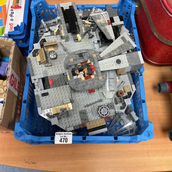 Incomplete Lego Star Wars Millennium Falcon model for collectors.