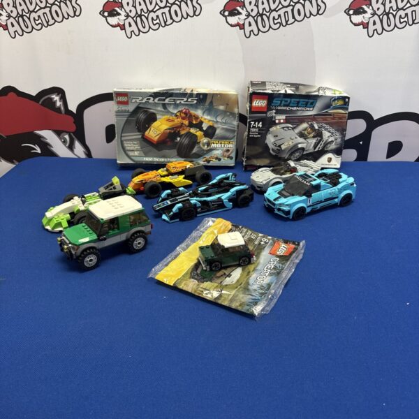 Lego vehicle lot including Technic and Racer sets for building and collecting.