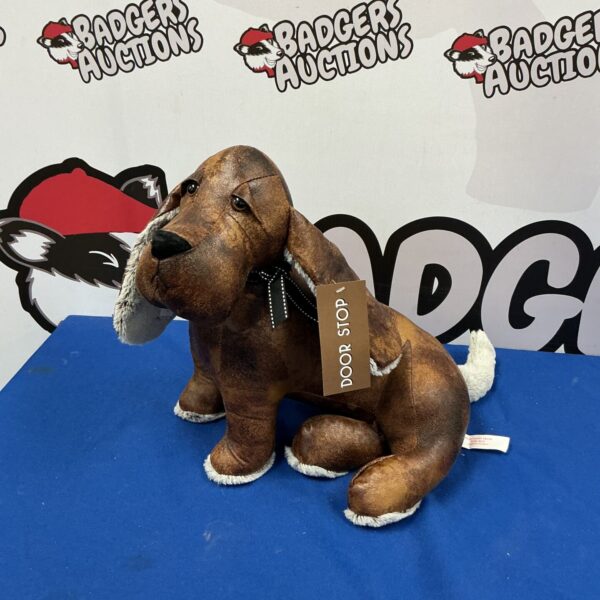 Vintage Lesser and Pavey cast iron dog door stop for home decor.