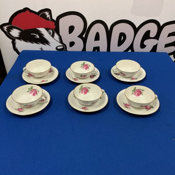 Vintage Limoges tea cups and saucers with floral design.