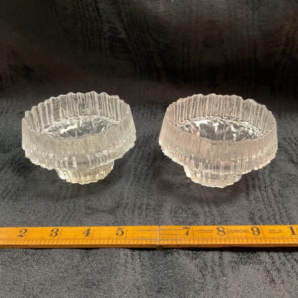 Pair of vintage Littala Stellaria candle holders with faceted design.