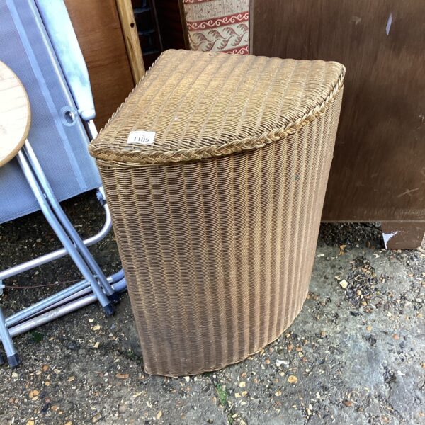 Vintage Lusty Lloyd loom corner wash bin for laundry storage.