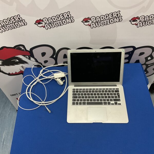 Silver Apple MacBook Air A1369 laptop computer for auction.