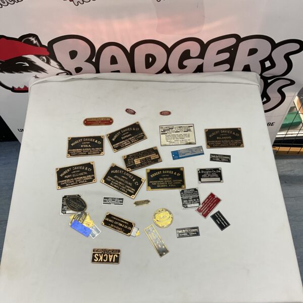 Vintage machine plaques lot, industrial metal plates and signage.