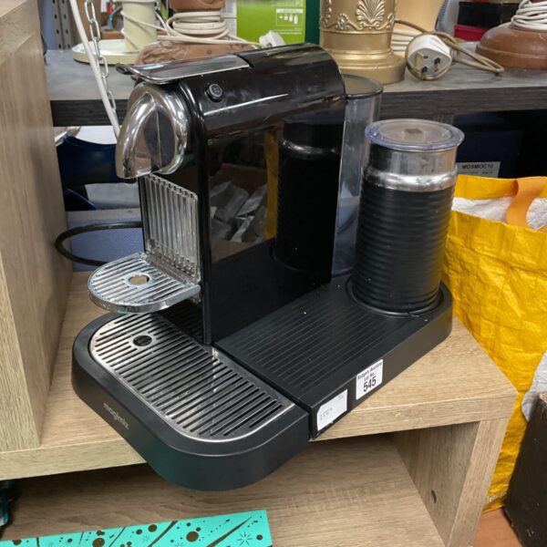 Sleek black Magimix Nespresso coffee machine for home espresso brewing.