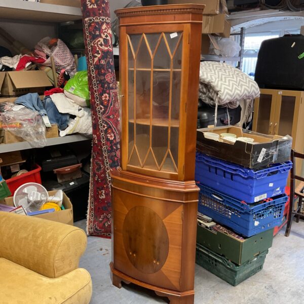 Antique mahogany corner display cabinet with glass front.