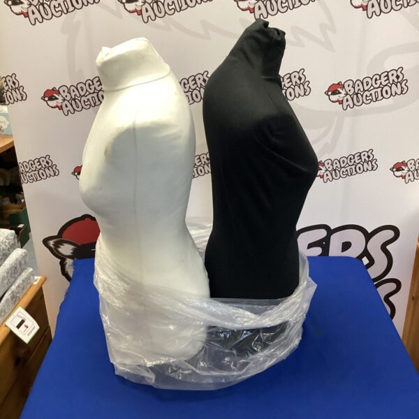 Pair of used female mannequin torsos for clothing display.