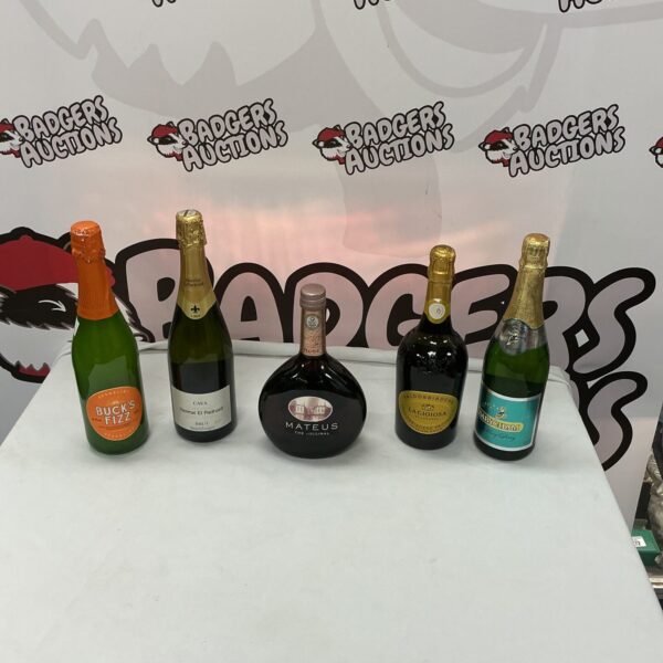 Vintage Mateus wine bottles in a collection of alcohol.