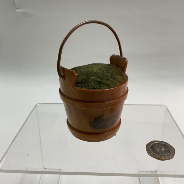 Antique Mauchline ware pin cushion, a charming Victorian sewing accessory.